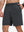 Front lower body shot of model wearing dark grey breathable running shorts with 4 zipper pockets
