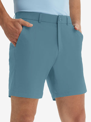 Front lower body shot of model wearing the blue stretch soft flat front dress golf shorts, showcasing the fit