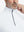 Close-up from nose to chest, showing collar and zipper detail of the white golf pullover.
