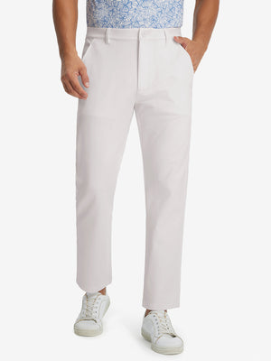 Model wearing Golf Lightweight Fleece Lined Dress Pants in oyster gray, lower body front view