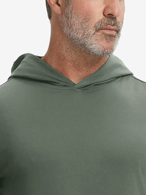 Close-up from nose to chest, showing soft collar texture and stitching detail of the olive green hoodie.
