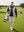 Model carrying a golf bag on the course, dry fit stretchy sweatshirts hoodies in black with sporty look