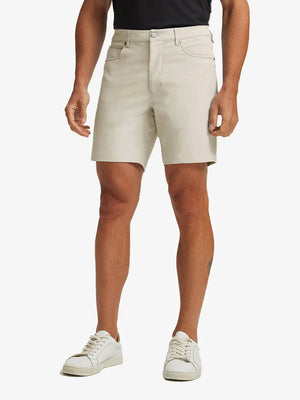 LIGHT KHAKI 4-way Stretch Performance Solid Shorts, golfer front lower body with club, 7 Inch view