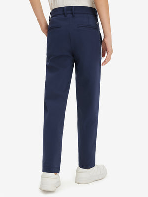 Boys Stretch Fleece Lined Casual Golf Pants in navy, back lower body view showing fit