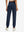 Model wearing women's stretch fleece lined water resistant joggers in navy, showing the back lower body view.