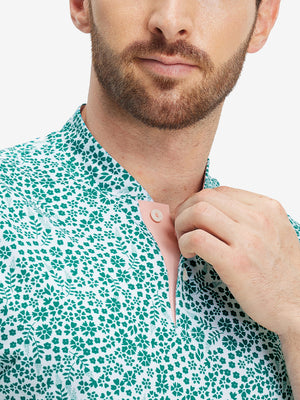 Close-up: nose to chest in white green florals stretch printed collarless henley golf shirts