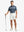 WHITE 4-way Stretch Performance Solid Shorts, golfer full-body front with club, 7 Inch length