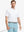 Model wearing Everyday Solid Jersey Polo in WHITE, front half-body holding golf club confidently.