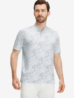 Front half-body of model in grey splatter stretch printed collarless henley golf shirts