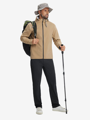 Model wearing a cap and backpack, holding trekking poles, dressed in black soft lightweight casual golf pants with 5 pockets.