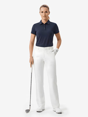 Front full body shot of model with golf gear wearing white women's regular fit stretchy golf pants