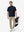 Full body model holding golf equipment, lightweight upf50+ short sleeve golf vests jacket in navy