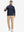 Model holding golf club wearing lightweight water-resistant outerwear jacket, active navy style