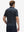 Back half-body view of model wearing the colorful sailboat 4 way stretch print collared polo shirt, highlighting the rear silhouette