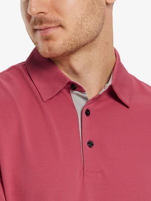 Model front close-up from nose to chest wearing BRICK Ventilated Pique Performance Polo