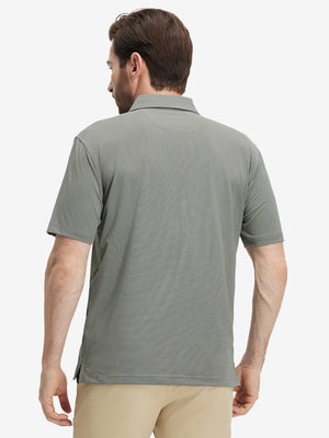 Back half-body view of a model wearing the black feather weight jacquard polo shirts, highlighting the rear fit