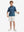 Full front: boy in space rocket performance print boys golf polo holding sports gear.