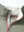 Detail shot of collar opening of dark khaki melange moisture wicking quarter zip pullover