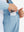 Hand placing iPhone into inner pocket of lightweight water-resistant outerwear jacket in light blue