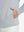 Close-up of pocket detail, single hand inside texture solid hoodies pullover, casual style in light grey heather.