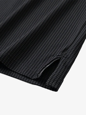 Close-up of hem slit detail on BLACK Elegant Performance Jacquard Polo
