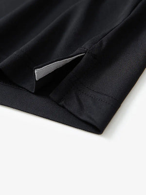 Detail shot of hem opening on BLACK Ventilated Pique Performance Polo
