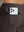 Back pocket detail of Water Resistant Comfy Fleece Golf Joggers in coffee brown, holding smartphone