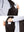 Close-up detail showing phone in the pocket of sleeveless softshell fleece outdoor vests with 6 pockets in coffee brown