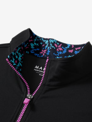 Collar zipper and inner neck pattern detail of the lightweight golf quarter zip pullover in black.