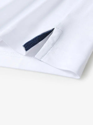 Close-up of side slit detail on the White Everyday Classic Solid Polo hem