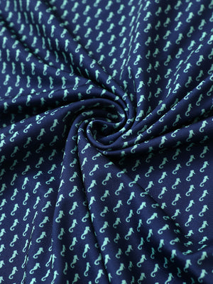 Fabric detail of Stylish print boys polo shirts with soft feel and green seahorse pattern