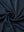 Close-up of navy heather modern fit melange polo fabric showing soft and textured surface.