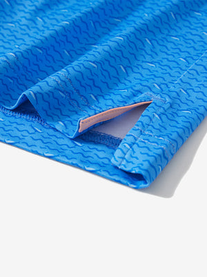 Detail: hem slit of blue wave dolphin stretch printed collarless henley golf shirts