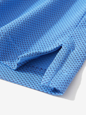 Detail of the side vent hem on the plum blue feather weight jacquard polo shirts, showing the split design feature