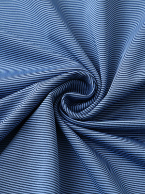 Fabric close-up of pinstripe jersey performance polo, fine stripe pattern with breathable blue denim stripe finish