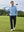 Model in light blue long sleeve solid jersey polo holding a golf club outdoors, full-body shot