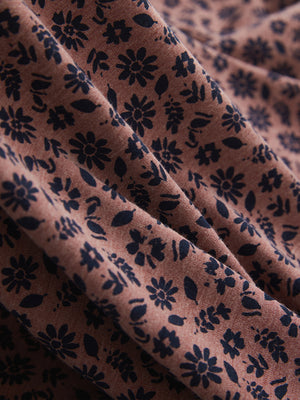 Fabric detail of Popular heather print polo with soft blended texture in wine red flower