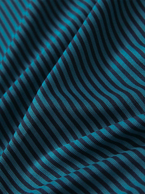 Close-up of turquoise stripe cooling stripe golf shirt fabric showing breathable texture and moisture-wicking stripes.