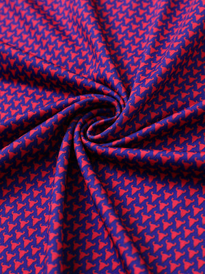Close-up of purple red buffalo performance jersey print polo fabric showing breathable texture.
