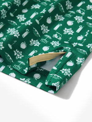 Close-up of the hem vent on the golf vacation 4 way stretch print collared polo shirt, showing the side split for movement