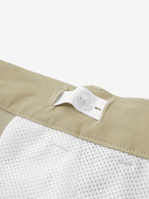 Interior shot of the waistband on the khaki youth water resistant cotton blend golf pants, showing inner construction
