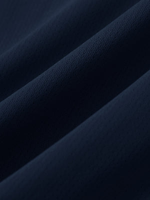 Close-up of soft mesh fabric for navy superion softness mesh joggers with zipper pockets