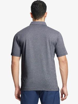 Front half-body shot of model holding golf club wearing Ventilated Heather Jacquard Polo – NAVY HEATHER