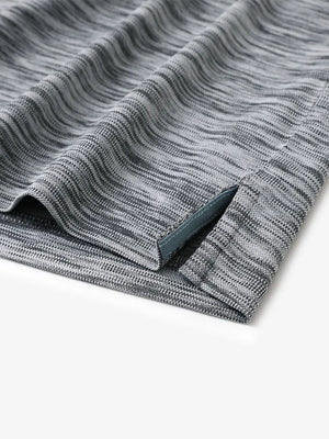 Close-up of the hem slit design in BLACK GREY HEATHER Cool Heather Texture Polo