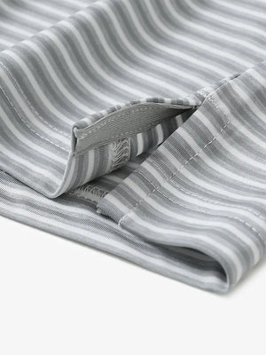 Close-up detail of hem opening on Sport Fit Stripe Polo in Grey White Stripe